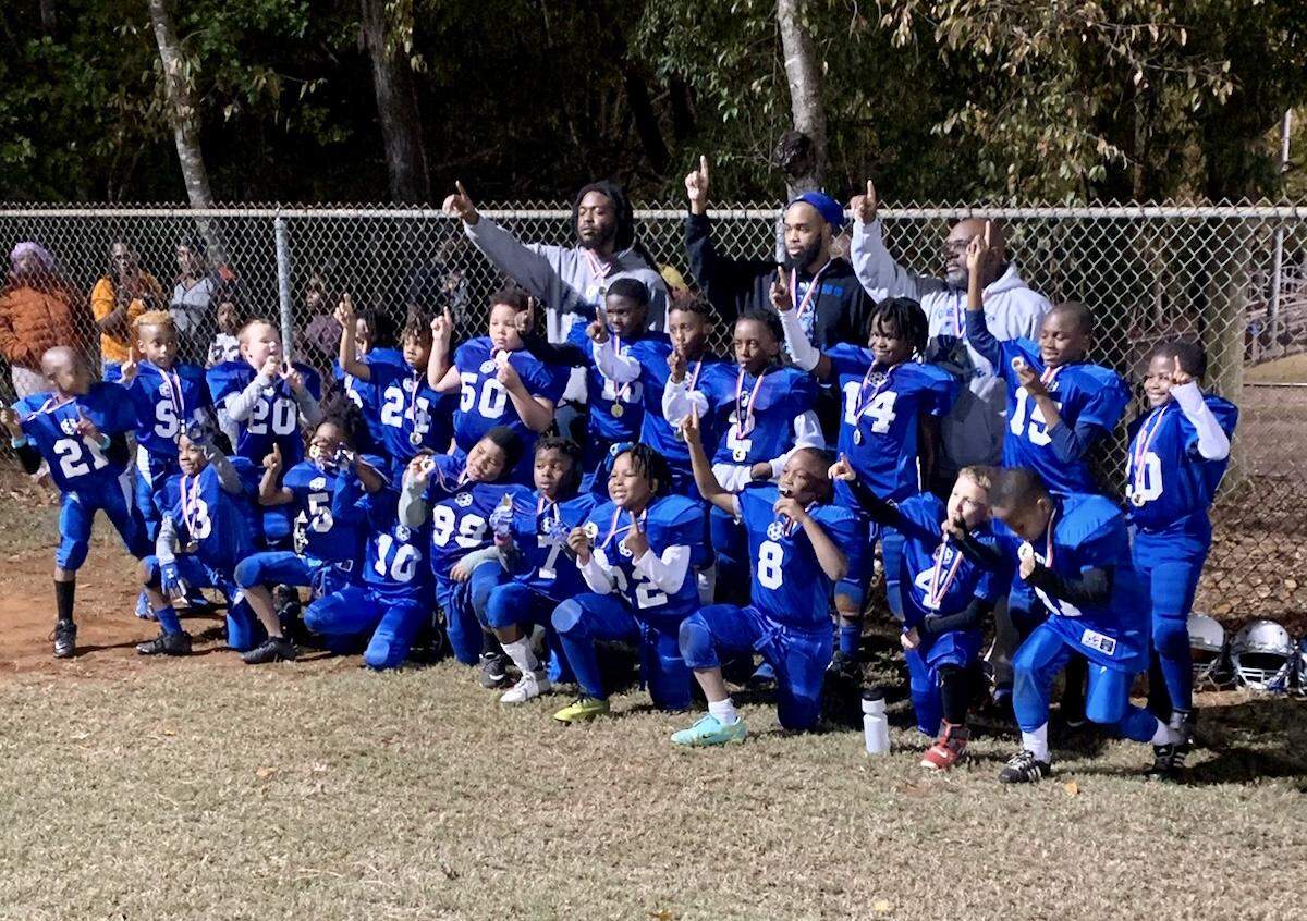 The Small Fry Demons pose for a picture after winning a championship on Tuesday night in Rock Hill.