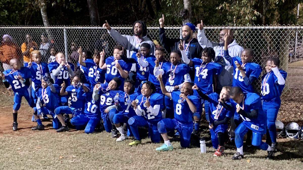 The Small Fry Demons pose for a picture after winning a championship on Tuesday night in Rock Hill.
