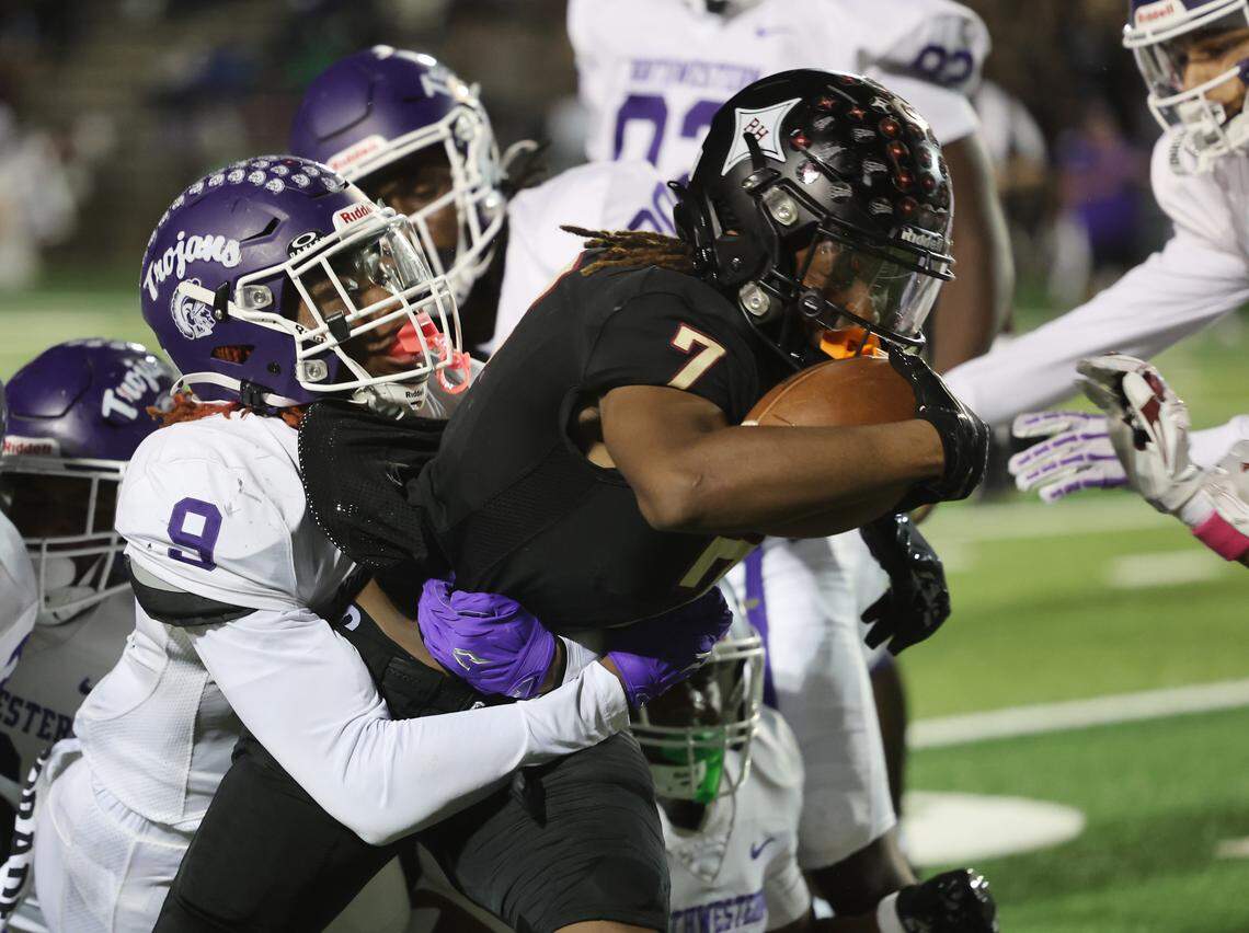 Rock Hill's Nigel Lightner (7) is tackled by Northwestern's Amarian Coleman Friday, Oct. 17, 2025 in Rock Hill, S.C.