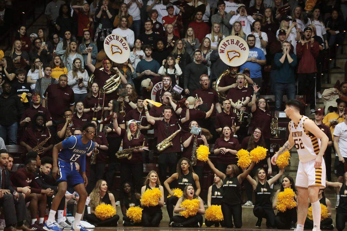 Winthrop University fans cheer Sunday during the Big South Championship at the Winthrop Coliseum.