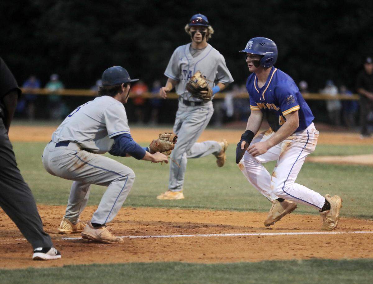 Fort Mill’s Eli Craddock heads back to third base towards Berkley’s Hayden Newbold.