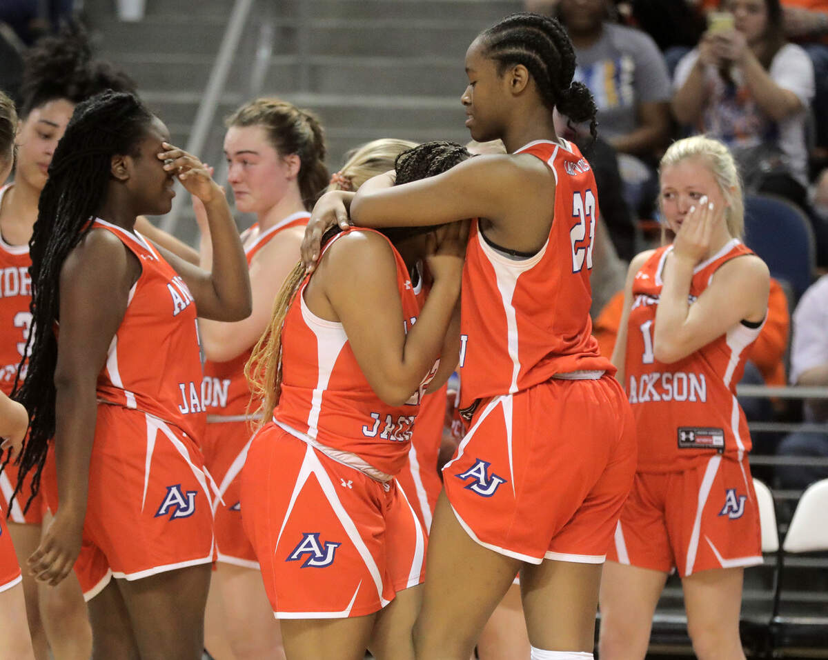 Andrew Jackson girls basketball players show disappointment after losing the class 2A state championships Saturday against Christ Church.