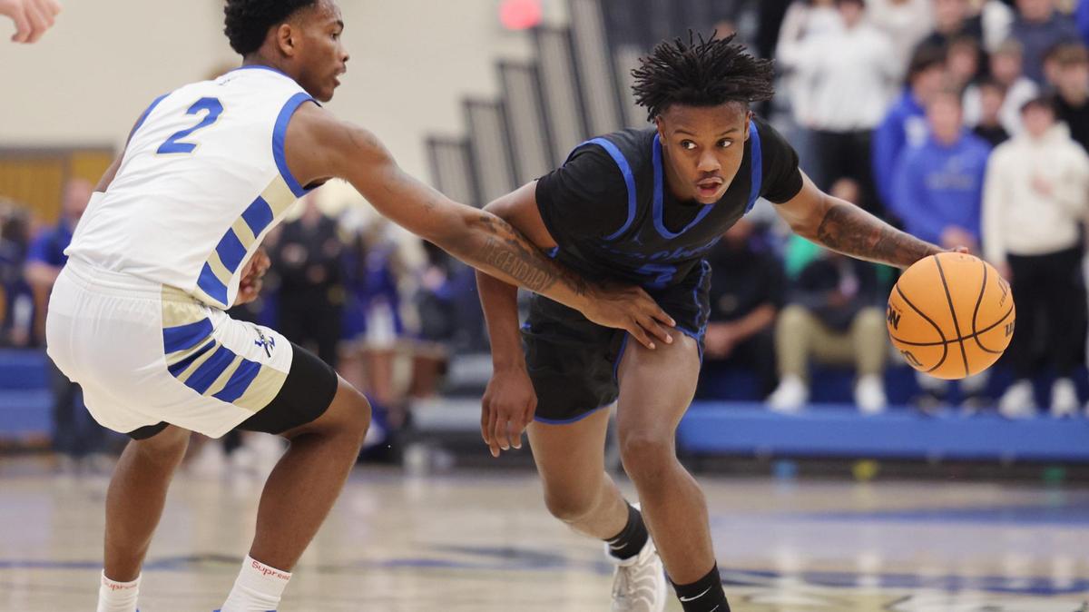 Fort Mill’s Nas Berry pushes past Indian Land’s Michael Jones Friday in Indian Land.