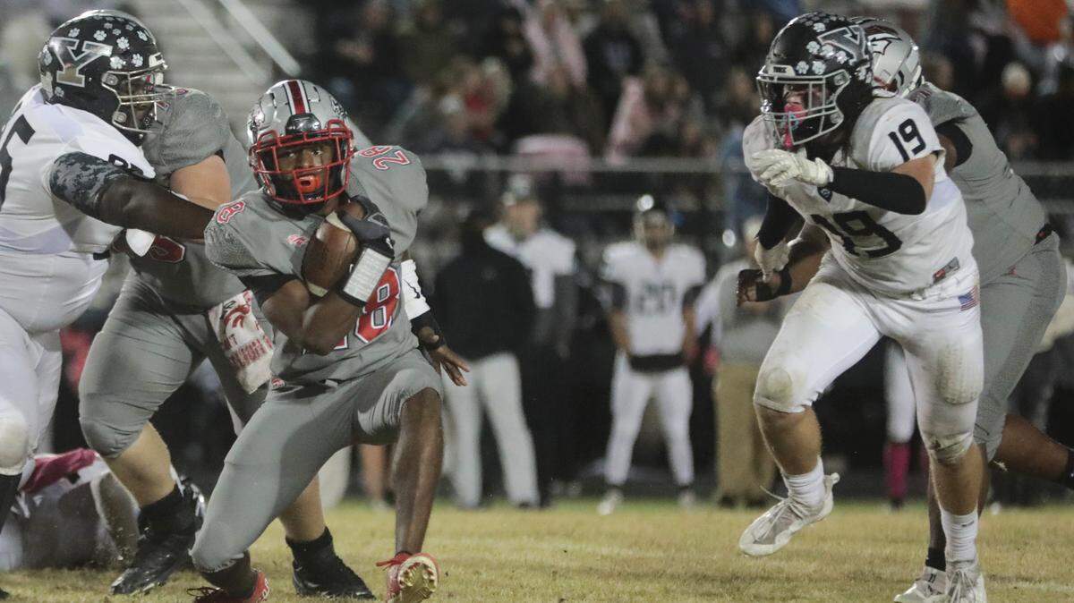 South Pointe’s Lavaris Copley carries the ball against York’s A.J. Mckinley (95) as Ashton Edington (19) follows from a game on Friday, Oct. 29. Both teams were in action on Friday, Nov. 5.