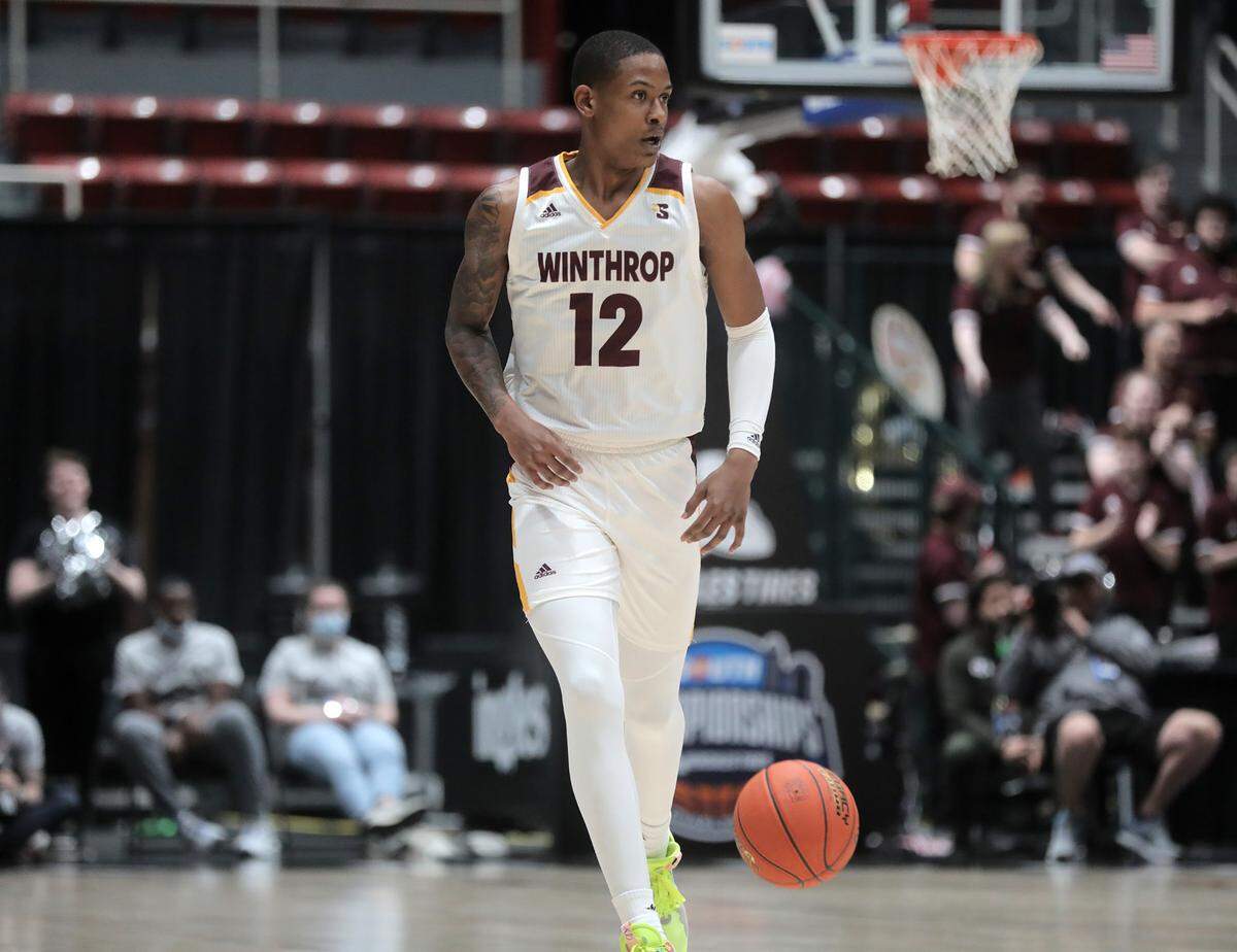 Winthrop’s Cory Hightower heads up the court Friday as Winthrop takes on High Point in the Big South Championship.