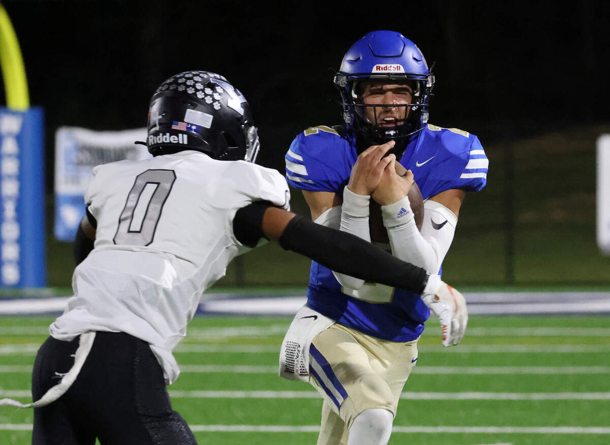 Indian land’s Jaxon Scheidt carries the ball against York’s Johnathan Tobias (0) Friday, Sept. 29, 2023.