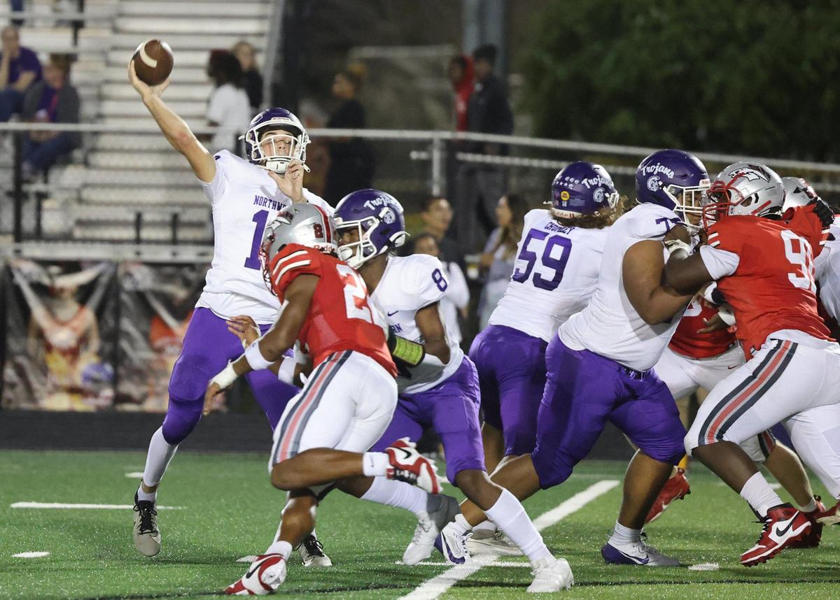 Northwestern quarterback Finley Polk looks for an opening Friday as the Trojans compete with the South Pointe Stallions in Rock Hill.