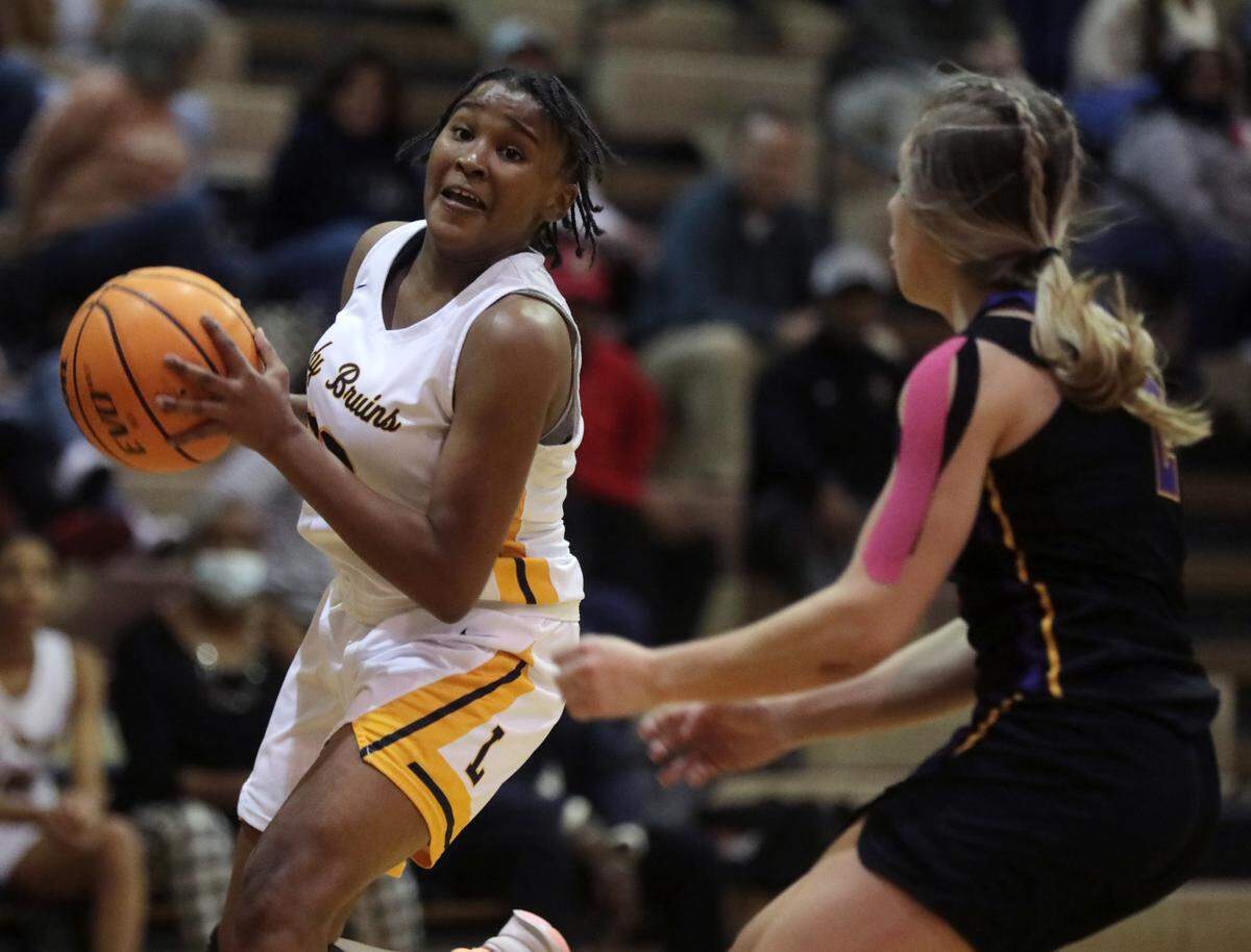 Lancaster’s Eliza Baskins, left, looks for an opening around Northwestern’s Darby Grigg.