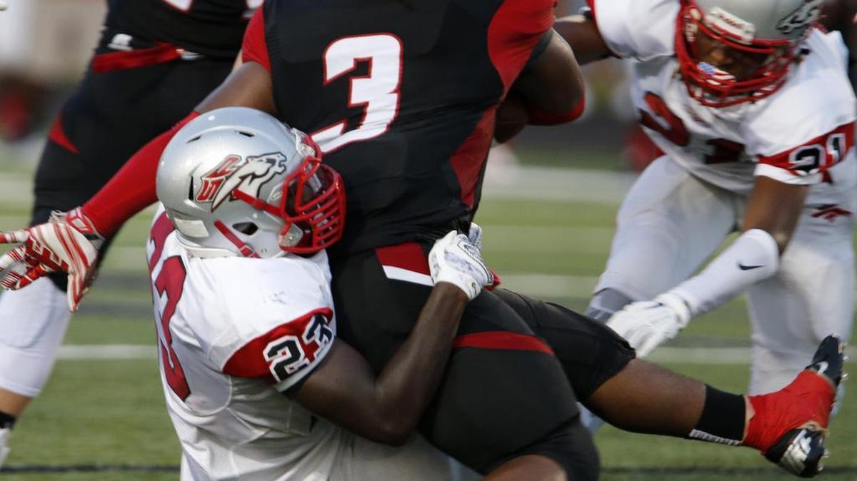 
Nation Ford High School hosts South Pointe High August 21, 2015. Nation Ford's Rayquwan Taylor (3) is taken down by South Pointe's Bryson Cooper (23).

