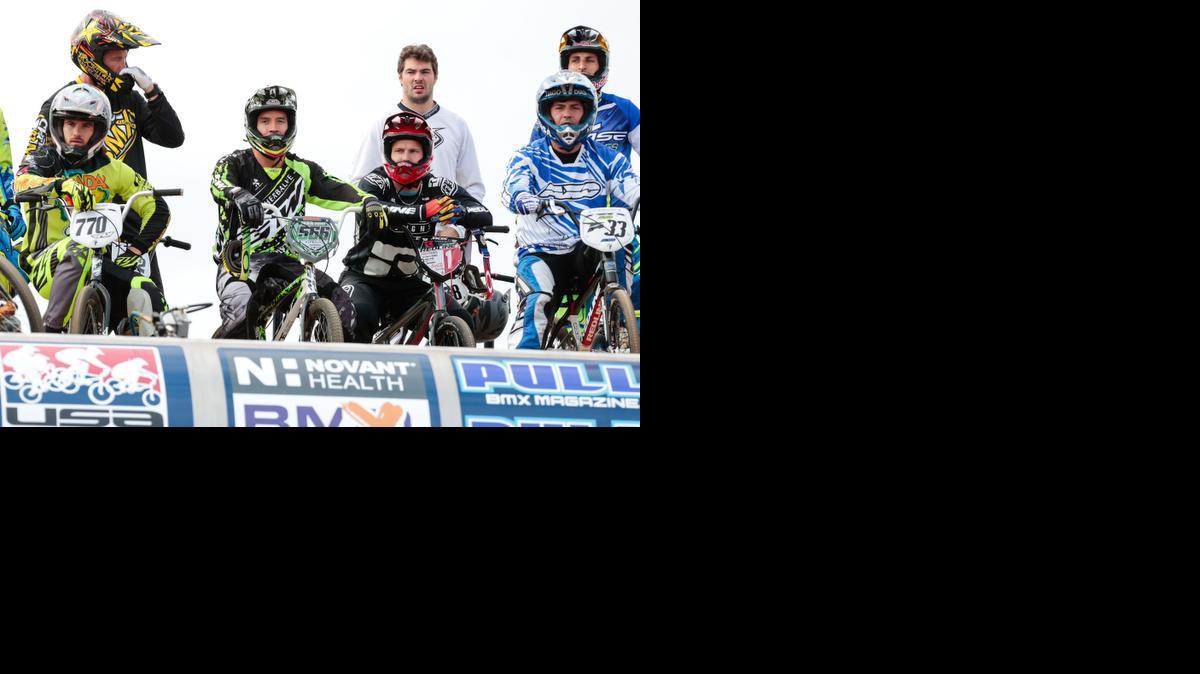 2012 Olympic bronze medalist Carlos Oquendo (#566 Center) sits at the starting line during a practice session as Rock Hill hosts the 2015 USA Cycling Elite National BMX Championships.  
Mar. 20, 2015