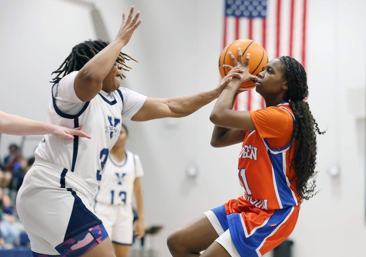 Andrew Jackson’s Syraiah Blair, left, looks for an opening around York Prep’s Malaya Chisholm.