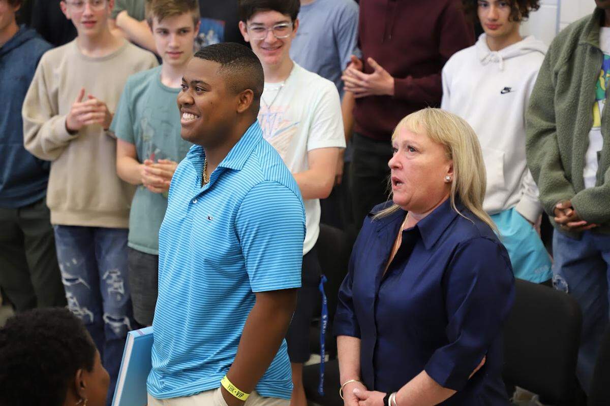 Earnest “EL” Dickey faces his classmates after being awarded a college scholarship by the NFL Players Association on Tuesday, May 10, 2022.