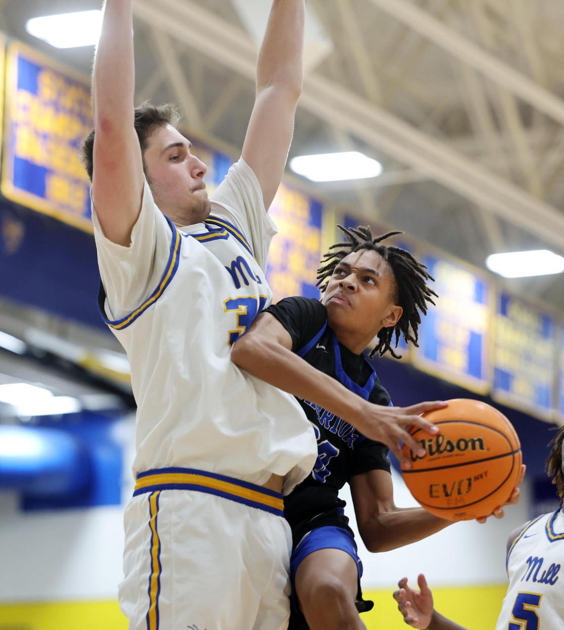 Indian Land’s Donovin Jones heads to the basket around Fort Mill’s Xander Gray Wednesday in Fort Mill.