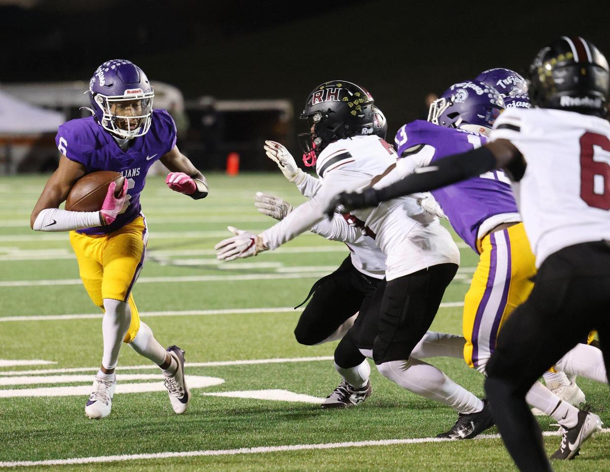Northwestern’s Daniel Caldwell carries the ball Friday, Oct. 18, 2024 as the Trojans take on the Rock Hill High School Bearcats in Rock Hill, S.C.