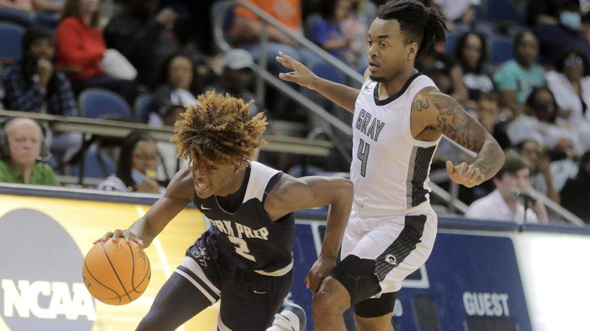 York Prep’s Kory Davis heads to the basket around Gray’s Calvin Hall.