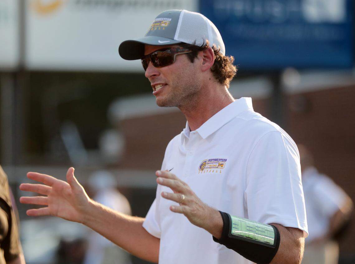 Northwestern High varsity football coach Page Wofford talks to coaches ahead of the game at the WRHI Kickoff in Rock Hill in August.