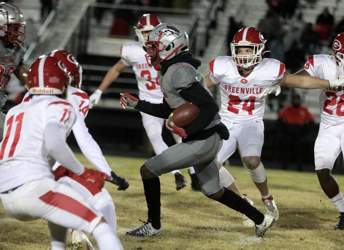 South Pointe’s Quan Peterson carries the ball during the upper state championship game in Rock Hill on Friday.