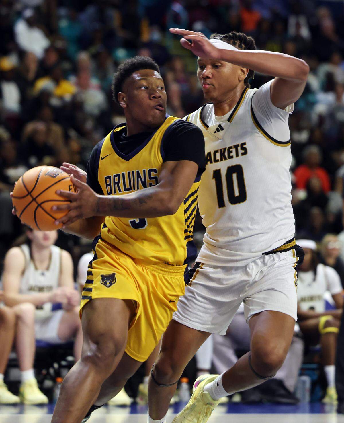 Lancaster’s R.J. Brown looks for an opening around North Augusta’s Daron Dunbar Friday at the Class 4A state championships in Florence