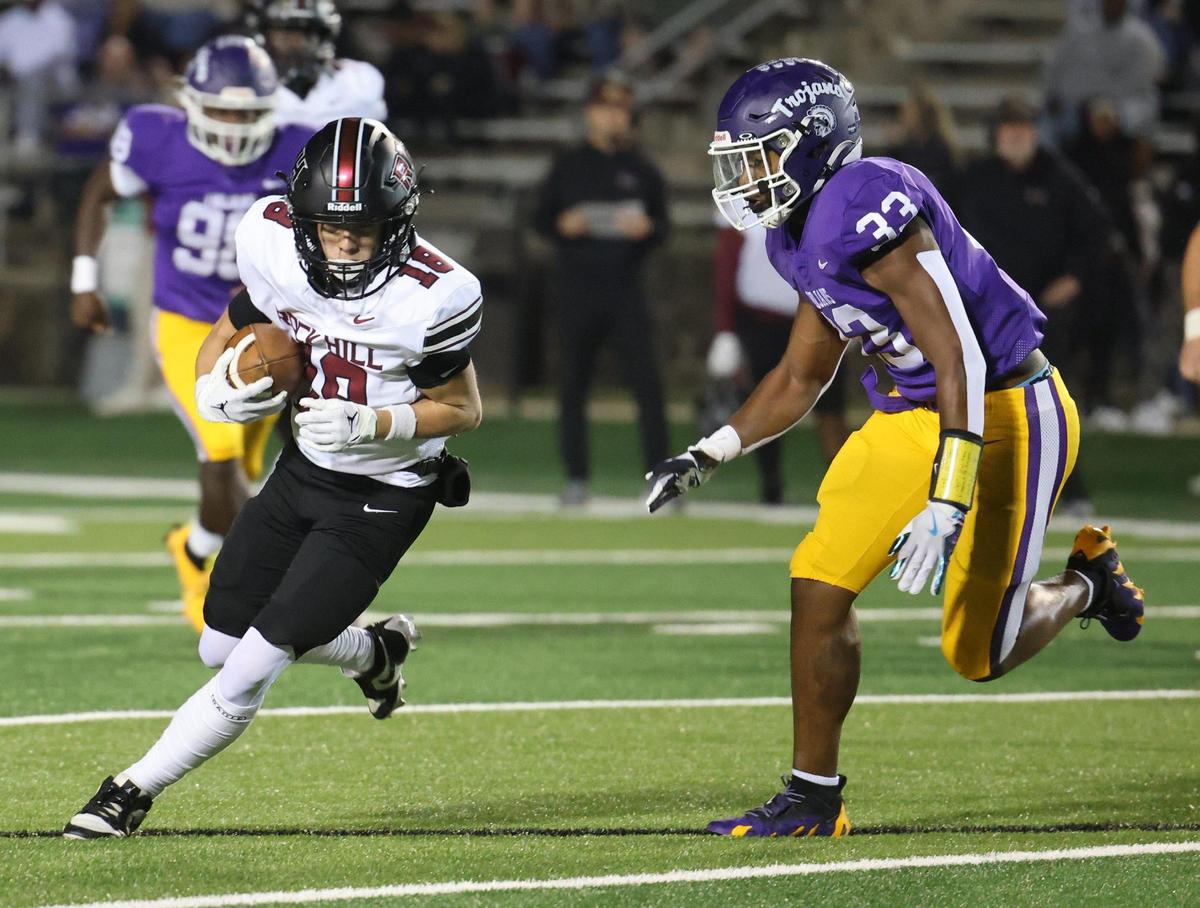 Rock Hill’s Max Sharp, left, carries the ball against Northwestern’s Kamerin Mcfadden Friday, Oct. 18, 2024 in Rock Hill, S.C.