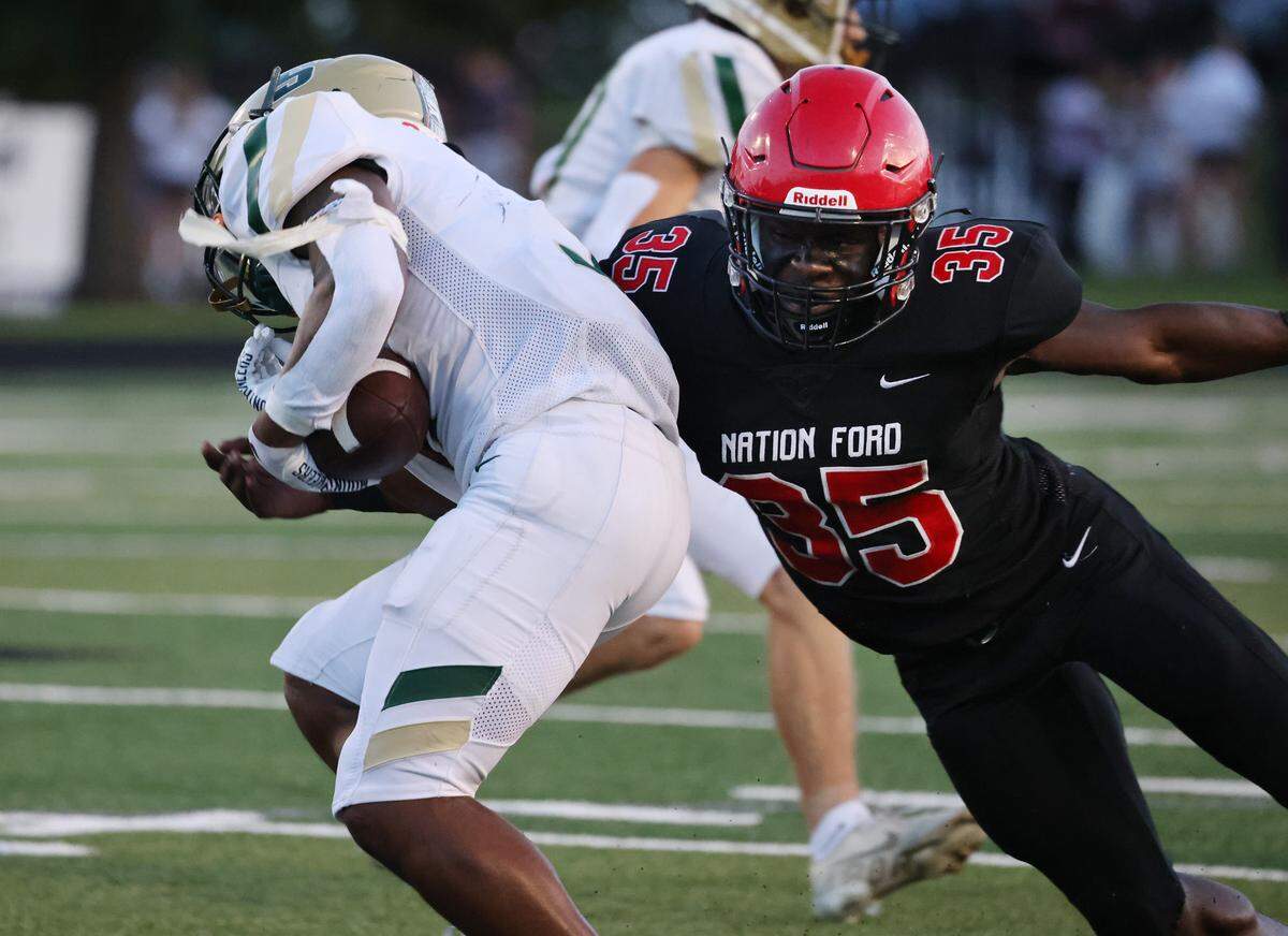 Nation Ford’s Antonio Crosby (35) tries to bring down Catawba Ridge’s Ira Mister during the first half of the Nation Ford v. Catawba Ridge game Friday, Sept. 1, 2023 in Fort Mill, S.C.