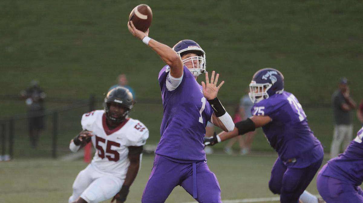 Northwestern’s Will Mattison throws the ball downfield Friday as the Trojans take on the Rock Hill Bearcats in varsity football.