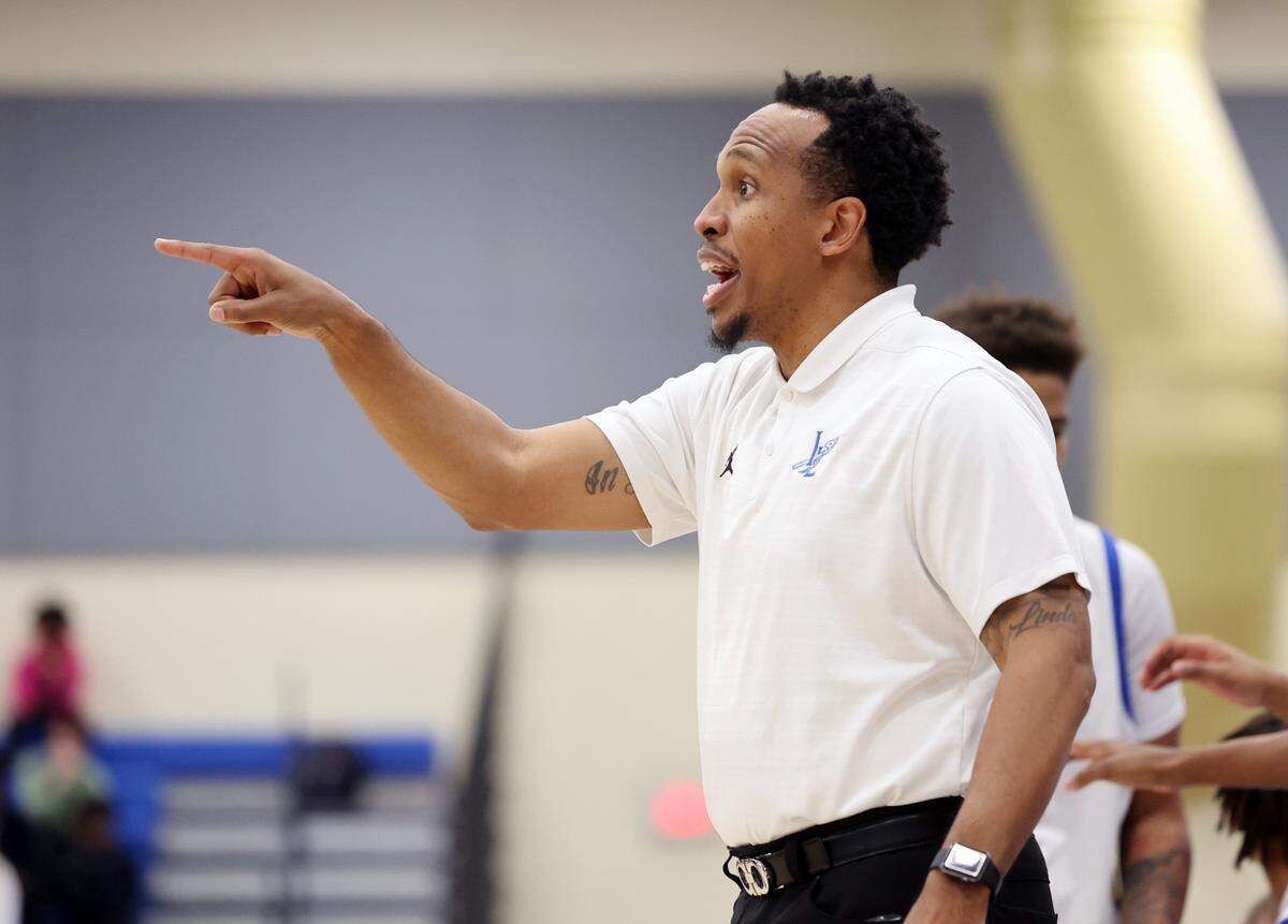 Indian Land head varsity basketball coach L.J. Johnson coaches his team Thursday as the Warriors take on the Catawba Ridge Copperheads in Indian Land.