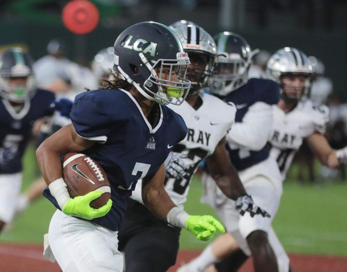 Legion Collegiate’s Sky Woodard carries the ball Friday as the football team competes against Gray Collegiate Academy in Gastonia, N.C.