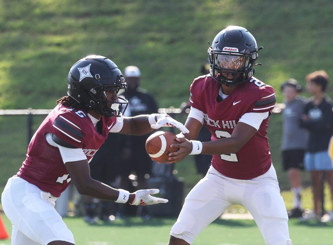 Rock Hill High School quarterback Jason Horton passes the ball to Jonah Young Friday, Aug. 15, 2025 at District Three Stadium in Rock Hill, S.C.