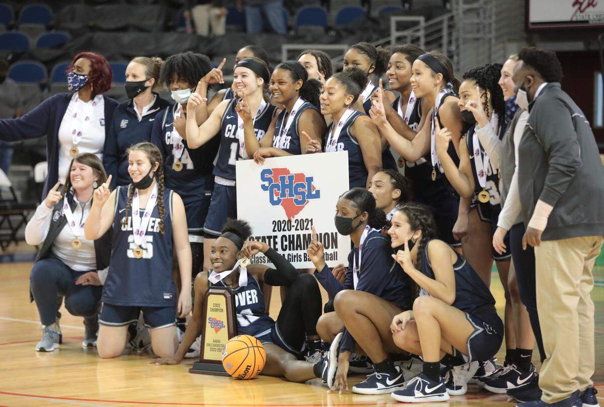 The Clover High School girls basketball team poses after winning the state championship game in Aiken.