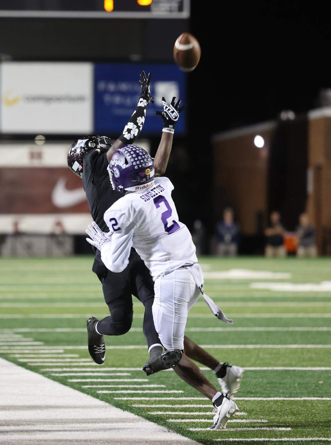 Rock Hill's Myles Brooks, left, tries to catch the ball as Northwestern's Josh Singleton tries to push him into the sideline Friday, Oct. 17, 2025