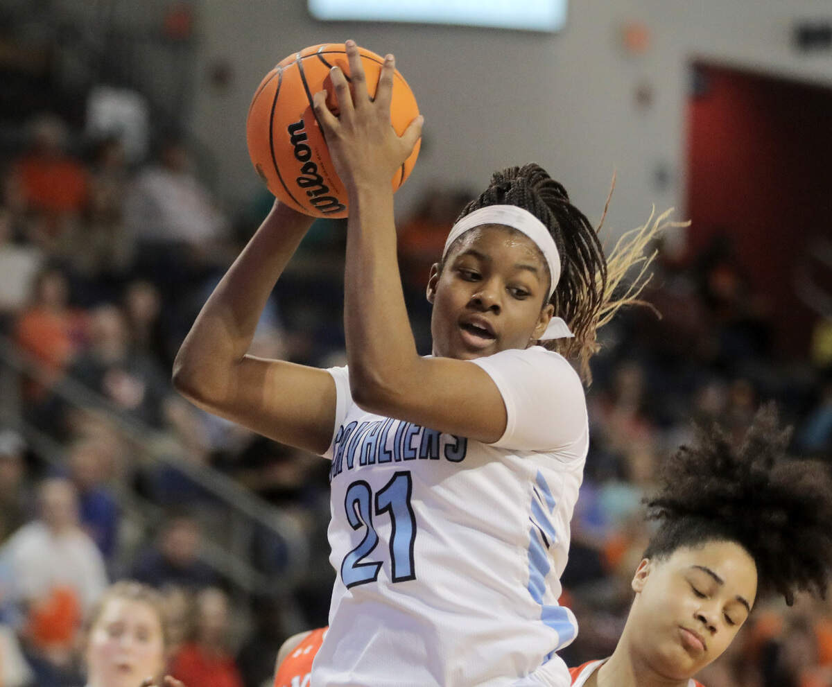 Christ Church’s Yasmene Clark grabs the rebound Saturday during the class 2A championship matchup with Andrew Jackson.