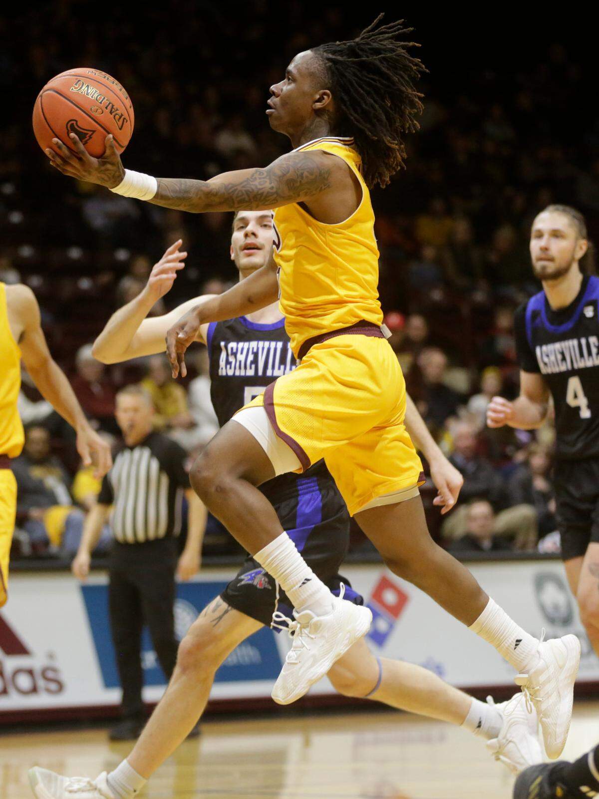 Winthrop’s Sin’Cere McMahon heads to the basket