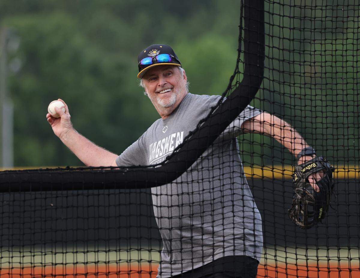 Kingsmen coach Joe Hudack throws a pitch Monday at practice at York Comprehensive High School.