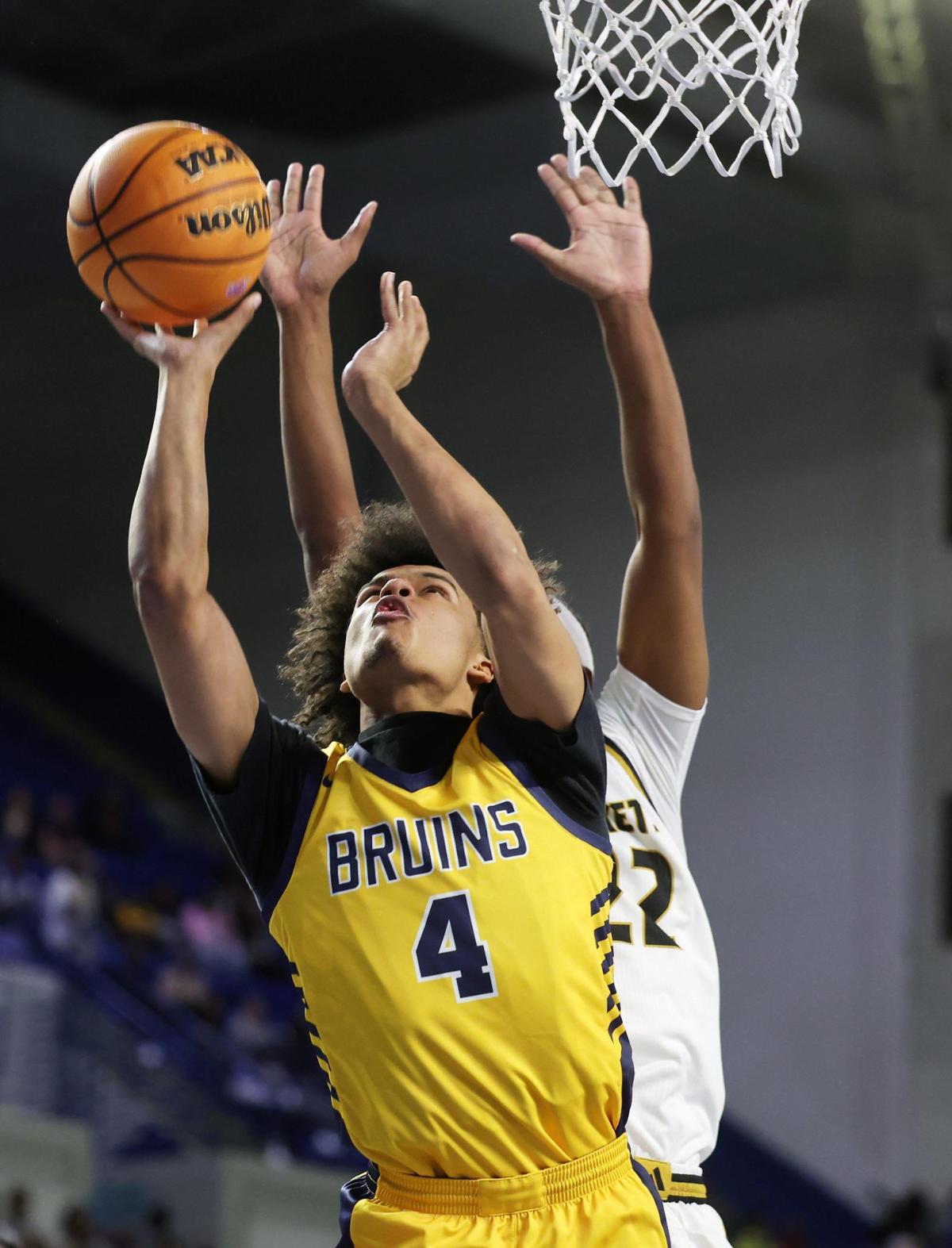Lancaster’s Columbus Parker heads to the basket against North Augusta’s Jamison Mckenzie Friday, March 7, 20025 in Florence