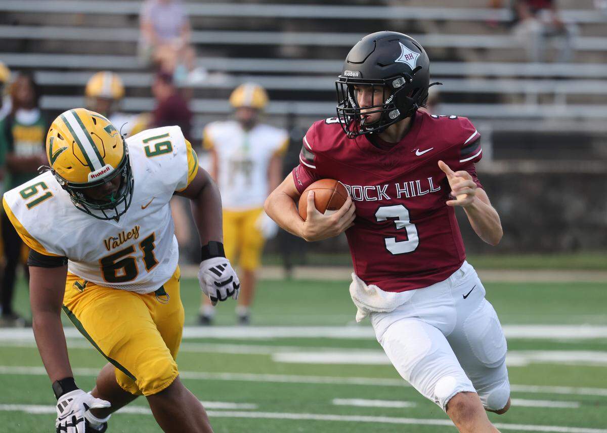Rock Hill's Jonah Young carries the ball in a game on Aug. 15, 2025, at the WRHI'S Football City USA Kickoff in Rock Hill.