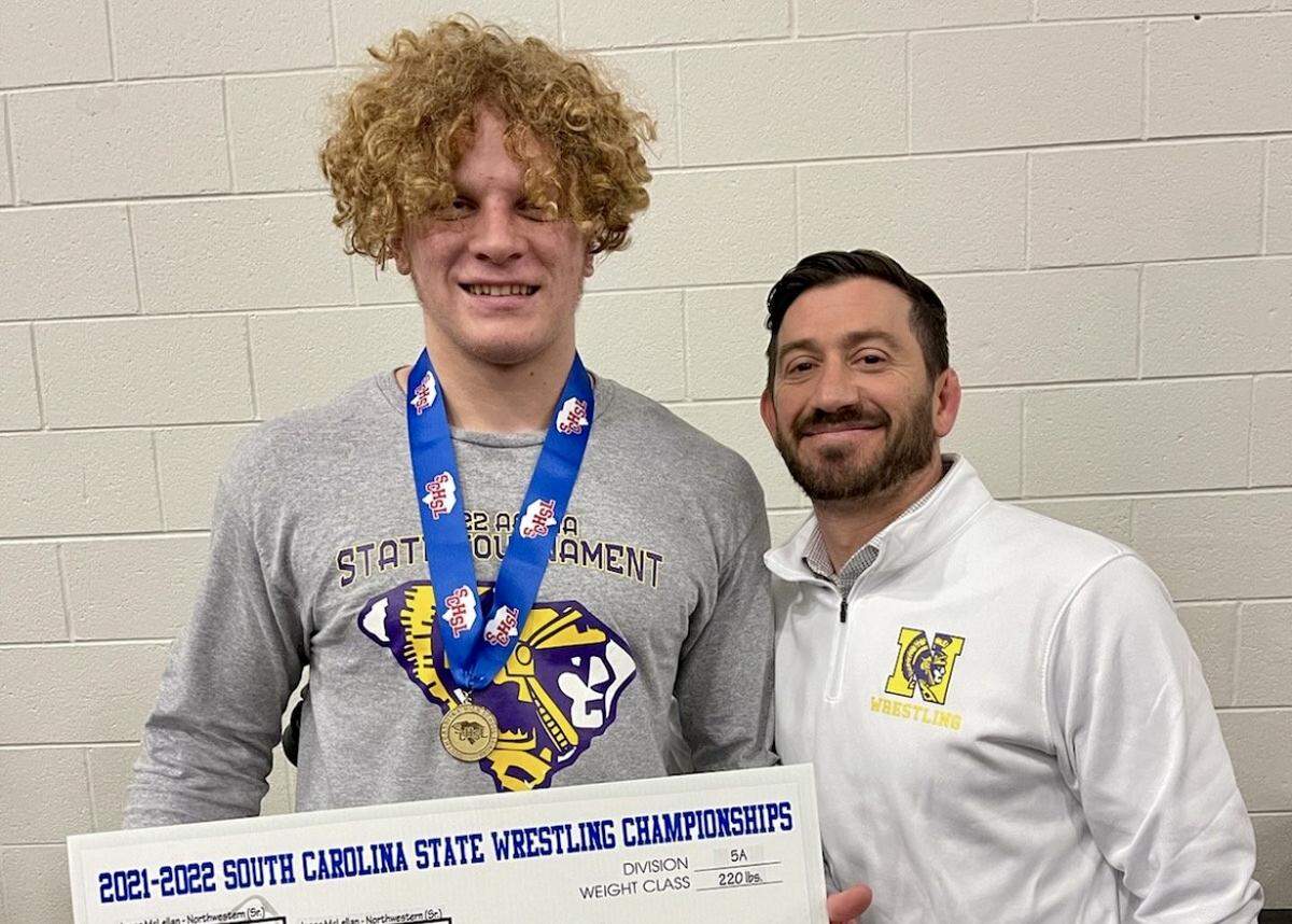 Isaac McLellan, left, of Northwestern High School won his second consecutive state championship this past weekend in Anderson. He’s pictured with his coach, Ryan Whitmore, right.