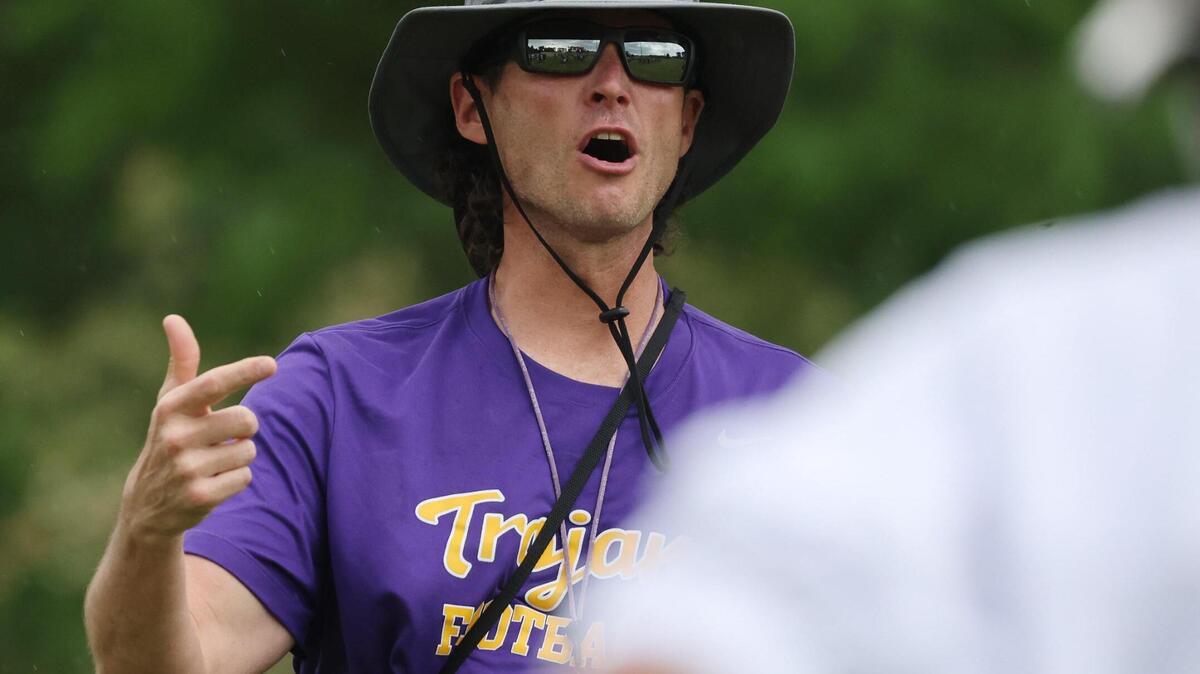 Northwestern High School head football coach Page Wofford yells to his players Thursday at the school.