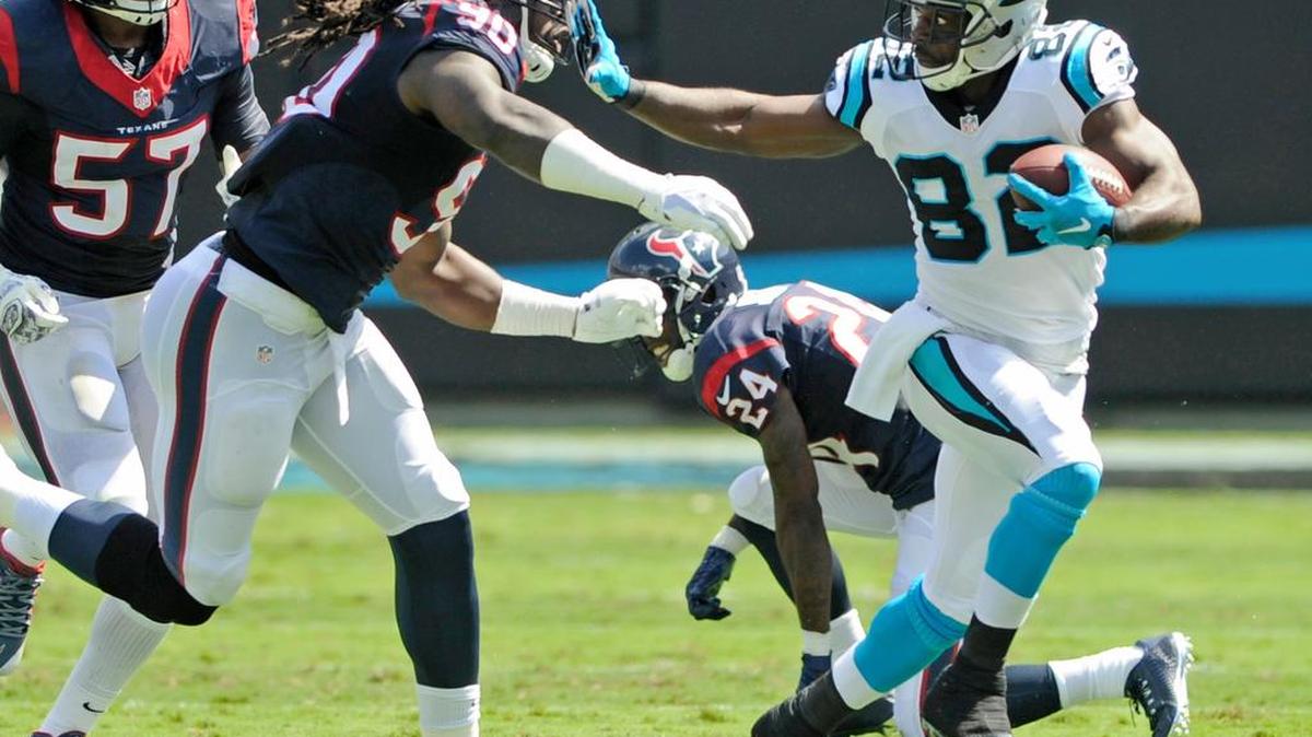 
Houston’s Jadeveon Clowney, a former USC standout, tries to run down Carolina’s Jerricho Cotchery during the Texans’ loss to the Panthers on Sunday.
