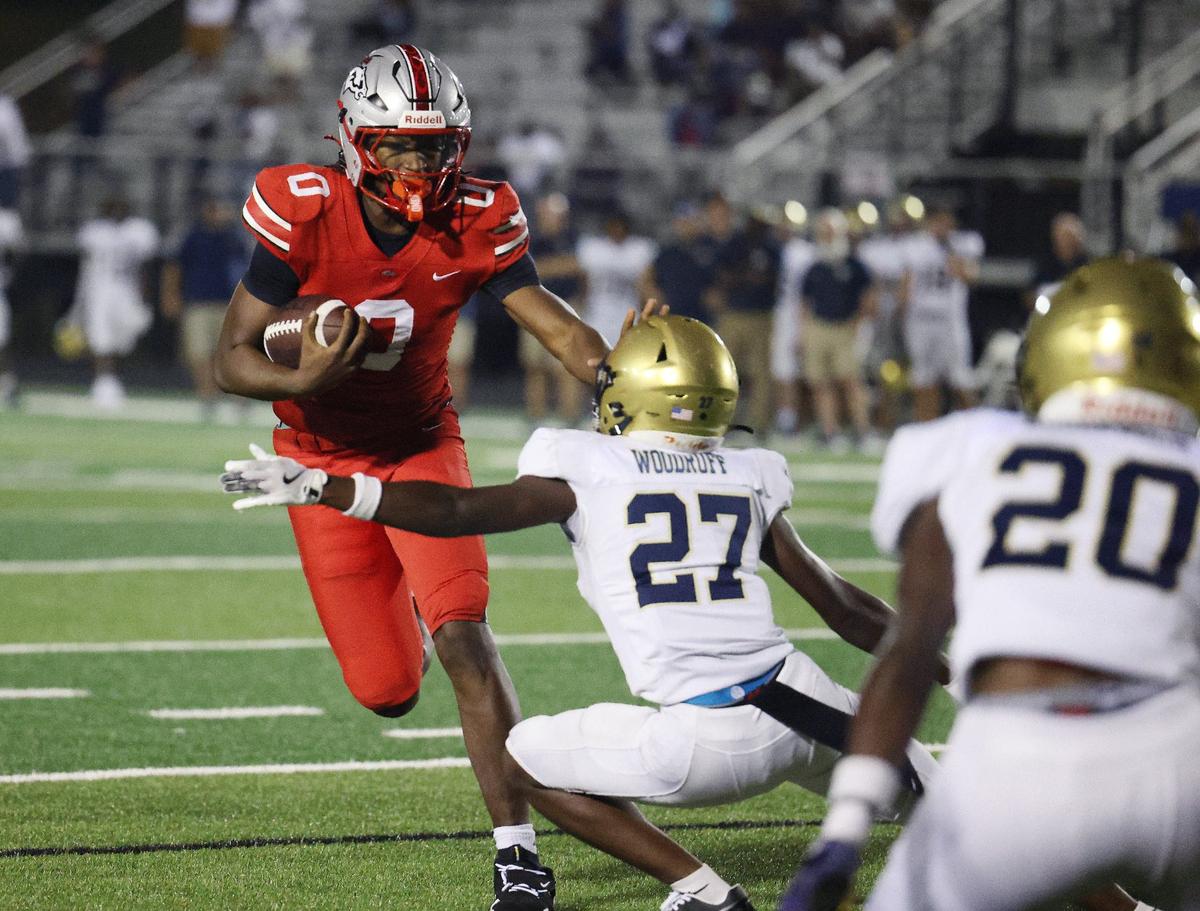 South Pointe’s C.J. Wherry holds off Spartanburg’s C.J. Woodruff.