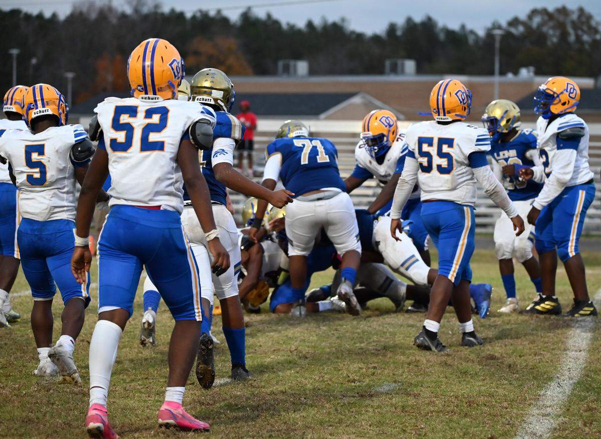 The Lewisville Lions varsity football team competes against Denmark-Olar Saturday during the second-round action of the SCHSL football playoffs. Read more at: https://www.heraldonline.com/news/local/article268678702.html#storylink=cpy