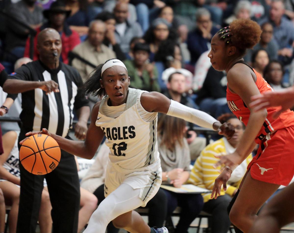 Clover’s Aleysha Wade looks for an opening around Mauldin’s Lauren Wearborn Tuesday at Clover High School.