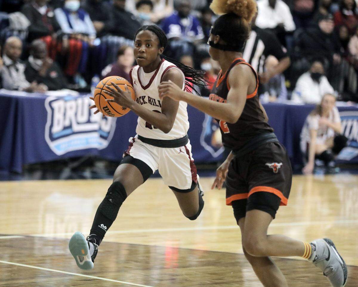 Rock Hill’s Jada Jones heads to the basket against Mauldin’s Lauren Wearbon.