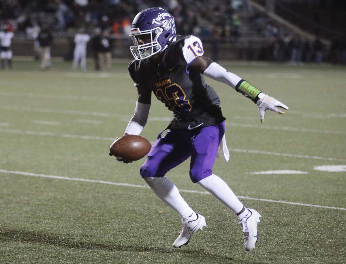 Northwestern’s Christian Watkins heads down the field.