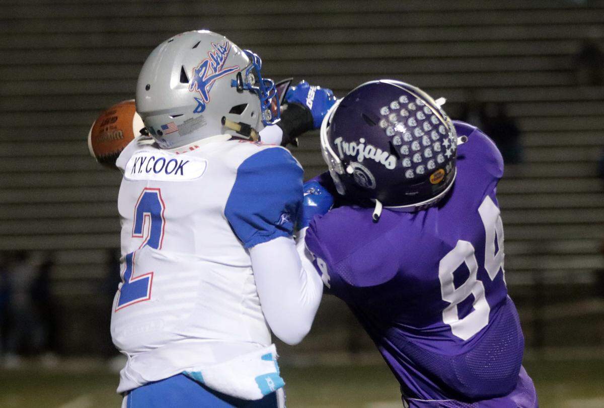 Northwestern’s William Brooks (84) and Byrnes’ Kyai Cook miss the ball.