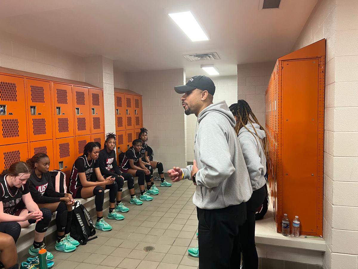Rock Hill head coach Kenny Orr talks to his team in the locker room following its 51-33 win over Mauldin.