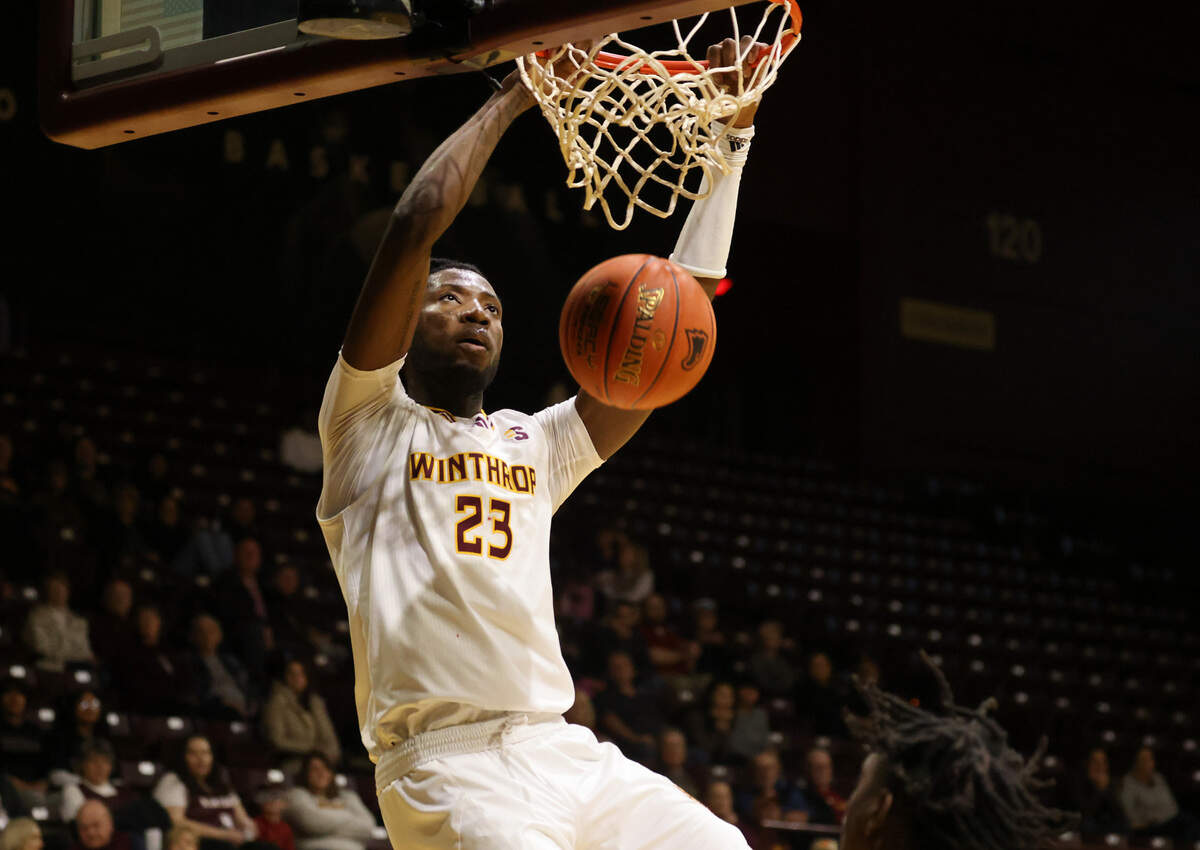 Winthrop’s Michael Moore dunks the ball Friday at the Winthrop Coliseum.