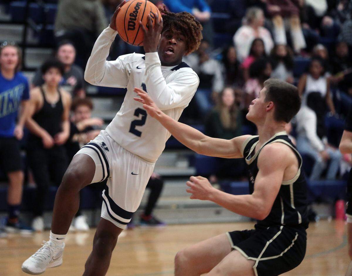 York Prep’s Kory Davis heads for the basket against Buford’s Brody Sanders.