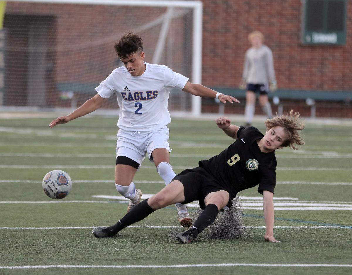 Catawba Ridge’s Joshua White (9) stumbles while Eastside’s Jack Redmond takes control of the ball.