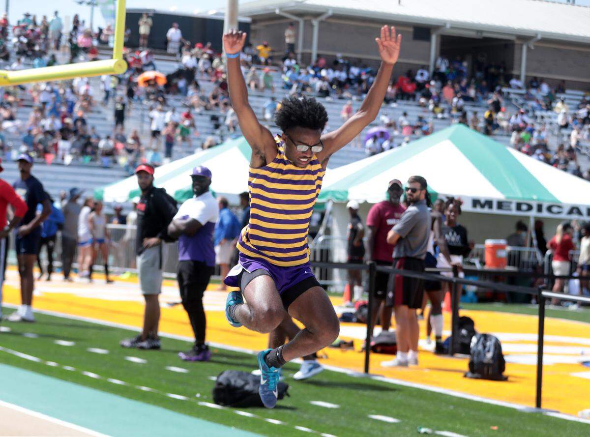 Northwestern’s Channing Ferguson competes in the long jump Saturday at the 5A track and field state championships in Columbia.