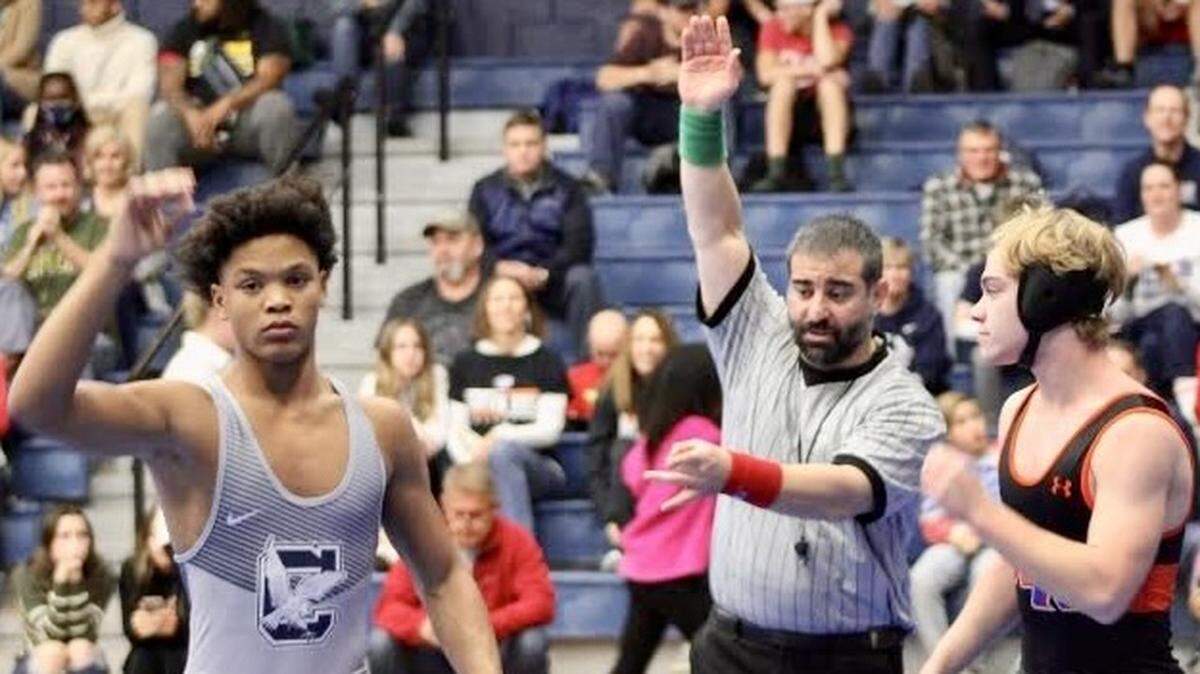 Yannis Charles of Clover wrestling celebrates a win from earlier this season. The Blue Eagles take on Northwestern in the third round of the 2022 playoffs on Monday.